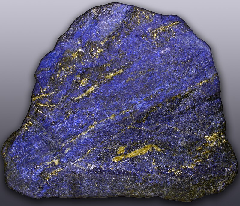 Raw lapis lazuli stone with deep blue and white calcite veins